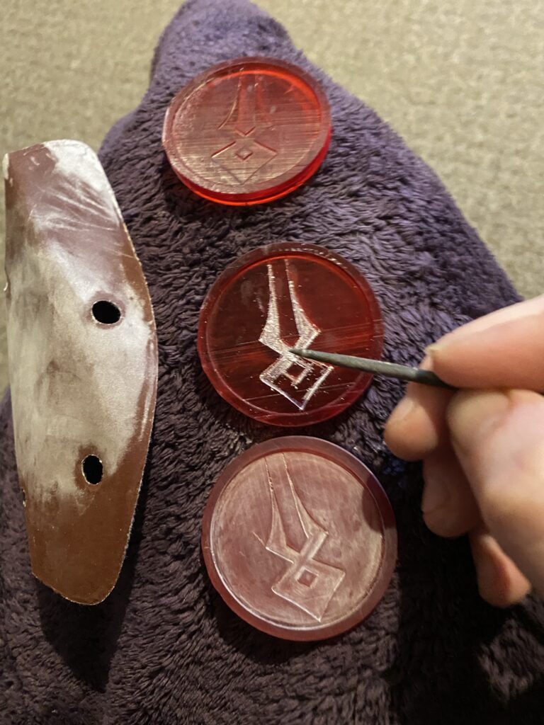 Three coins at the start of sanding.