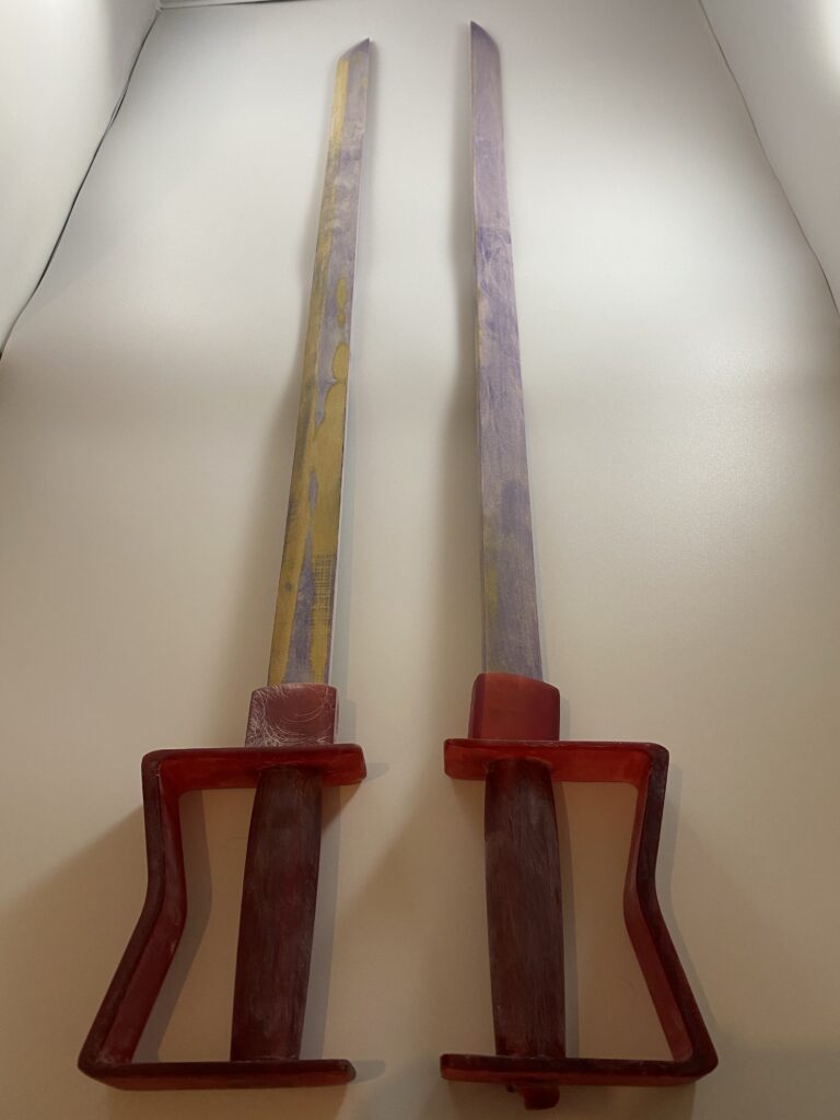 Prototype I & II of General Olivier Armstrong's sword, half completed. Next to each other.