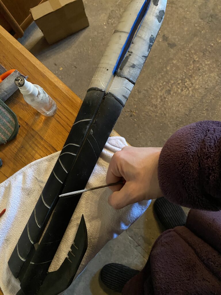 Etches being made in the black finish.