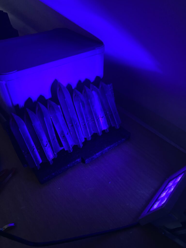 The spikes curing under a UV Blacklight.