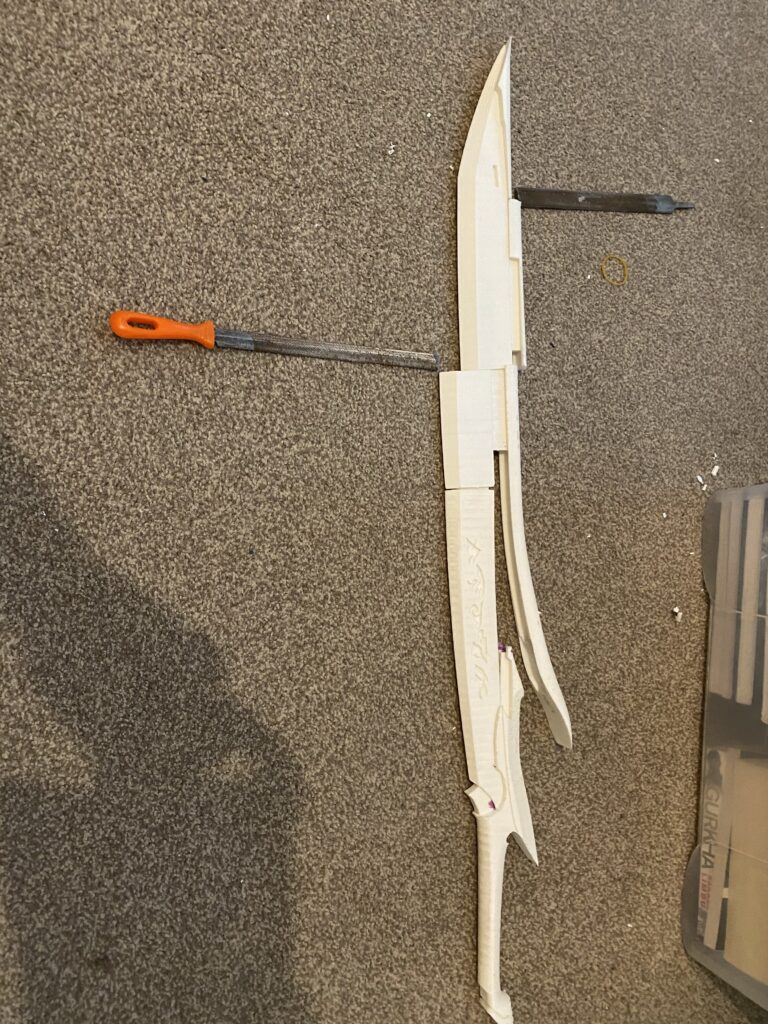 Handle, base of blade and both parts of the spine completed.