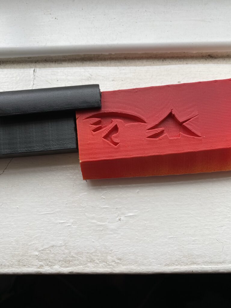 Red and Matte Black scrap plastic.