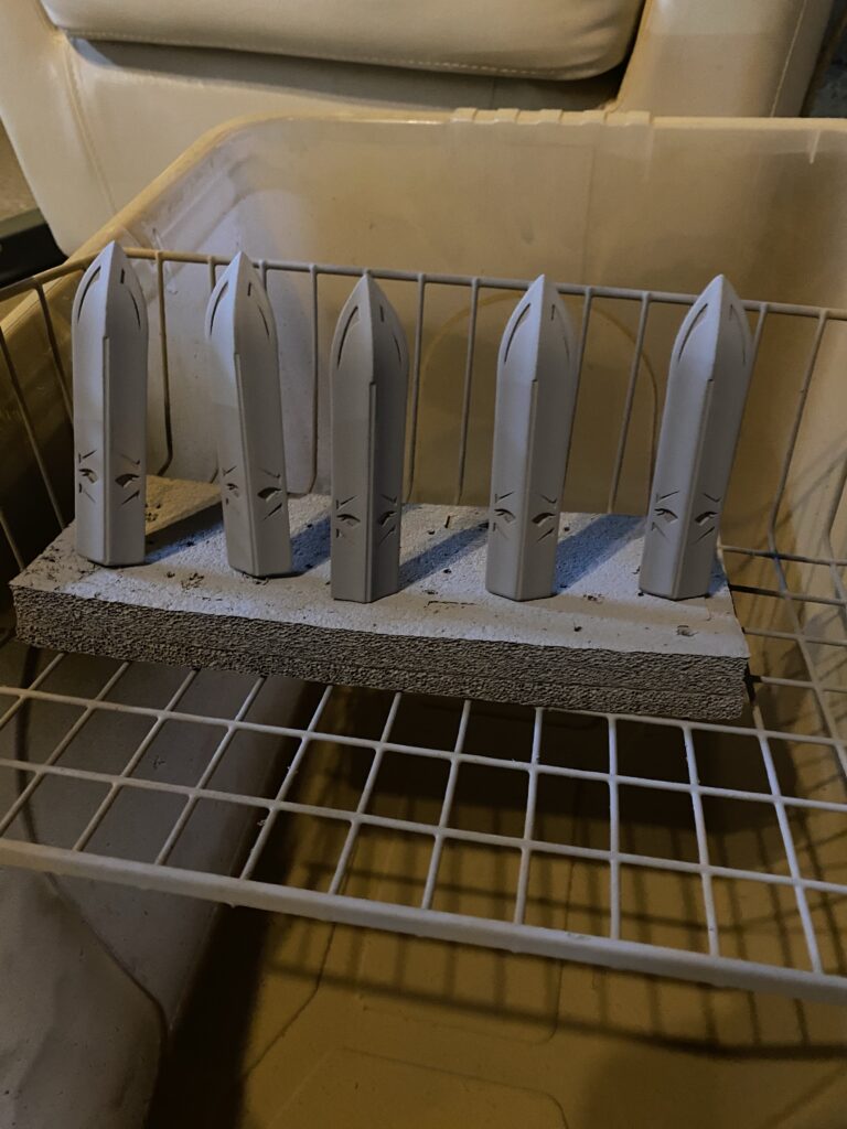 Large spikes getting grey primer.