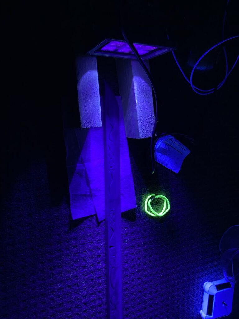 UV resin curing under a blacklight.