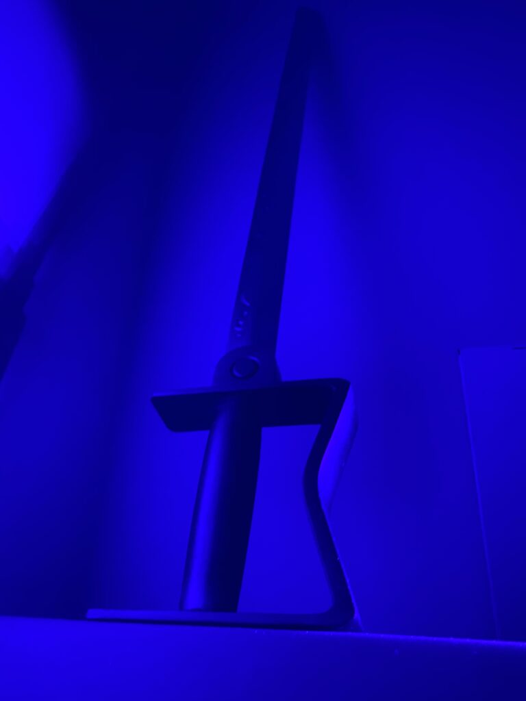 The full sword stood up under a blacklight just to look cool.