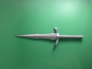 Raw Build loki dagger on a green background.