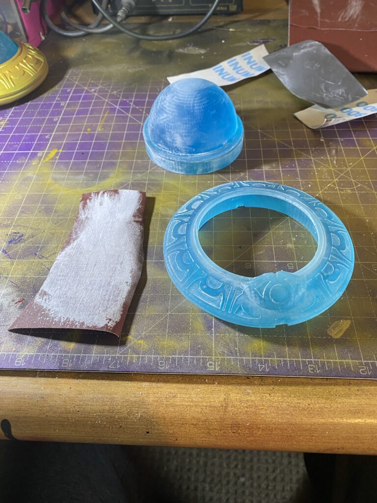 Sandpaper, the ring, dome and base.