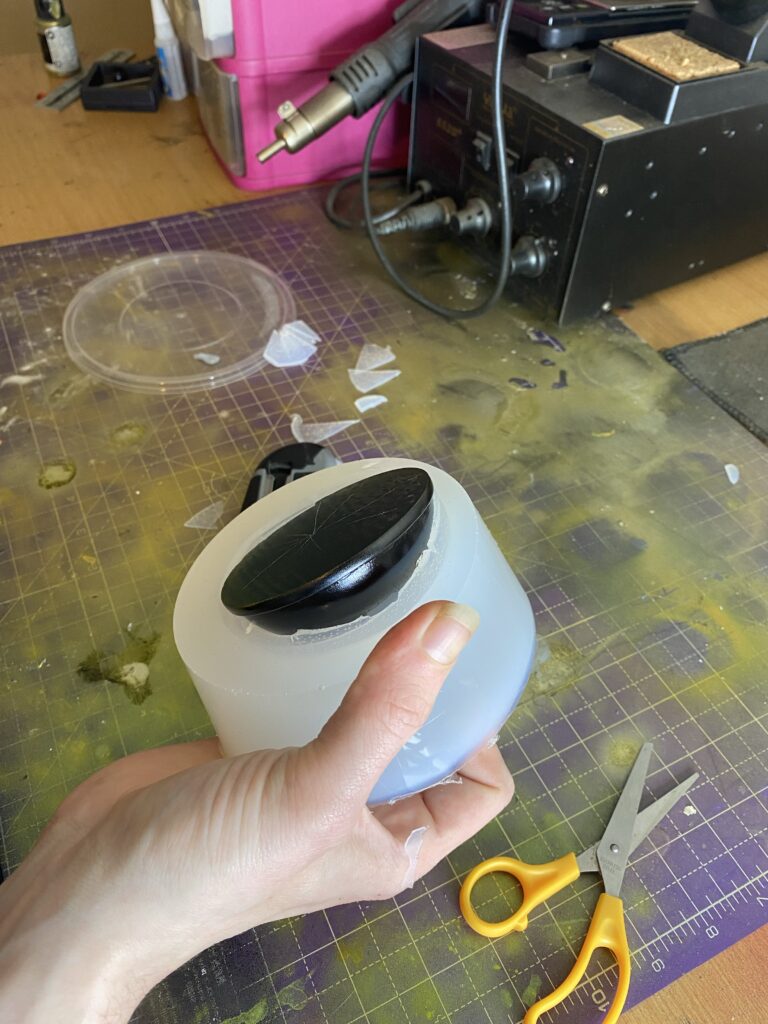 Dome being removed from silicone mold (mould?)