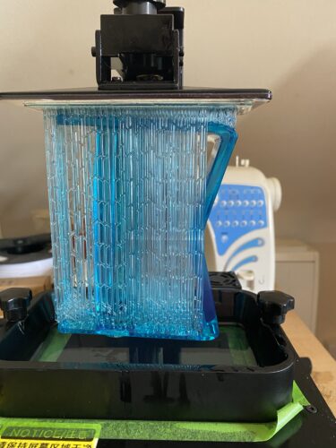 Wrath's Sword handle being printed in UV resin on an SLA printer