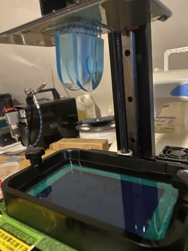 A small part of Wrath's Sword handle being printed in UV resin on an SLA printer