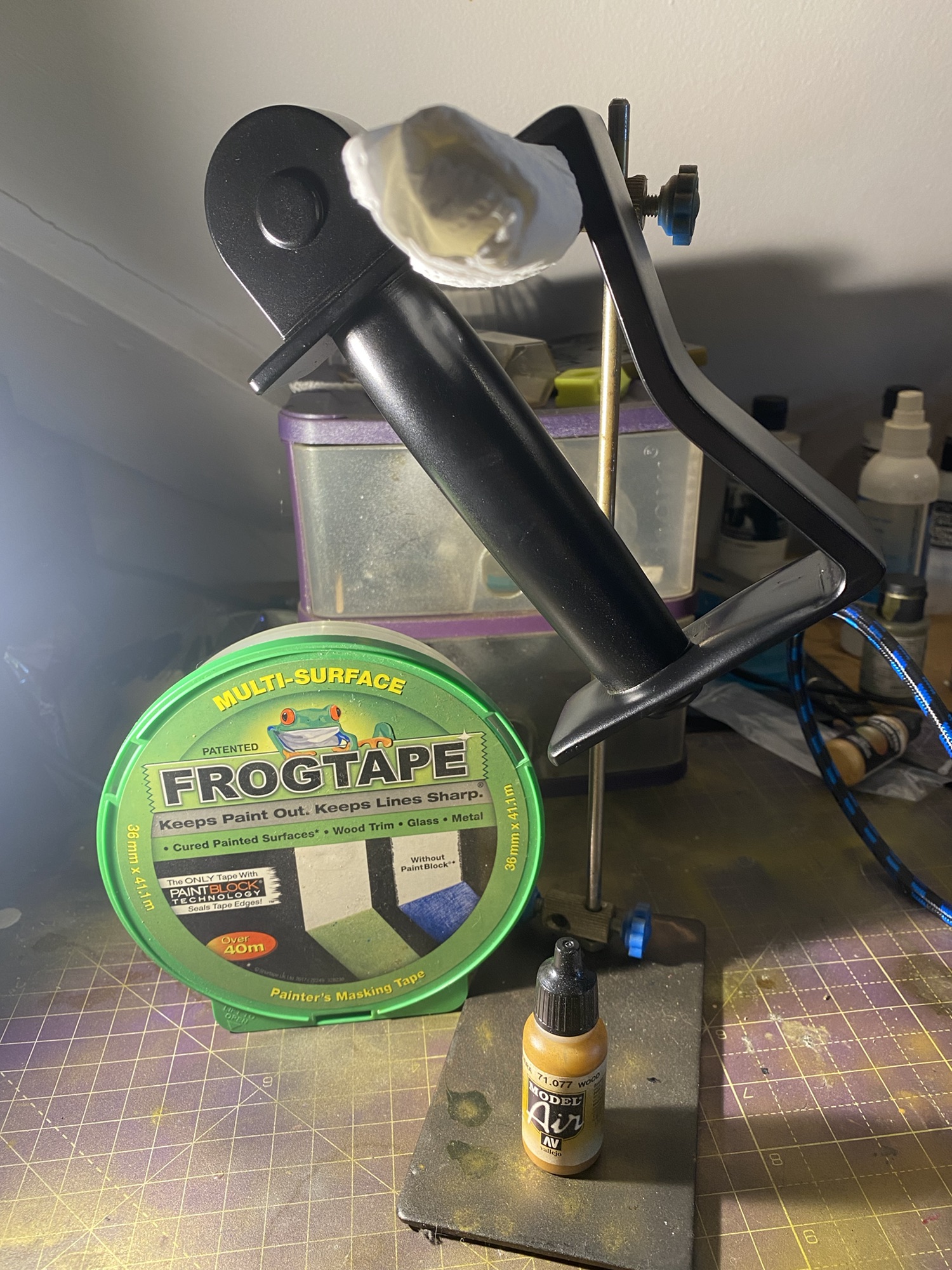 Frog tape next to the hande for King Bradleys Sword