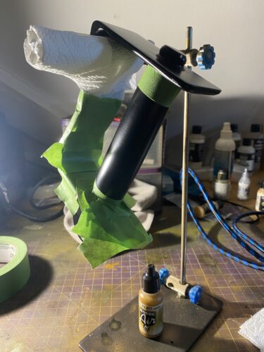 Frog tape on the hande for King Bradleys Sword with the wood paint close.