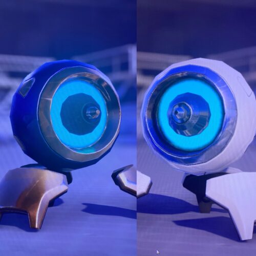 Bad quality images of Symmetra's Turrets from the game, the purple Dragon Skin on the left, default white on the right.
