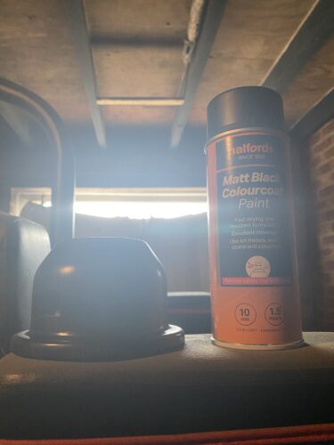 The base of the Symmetra Turret 3D Print is stood next to a can of matt black spray paint.