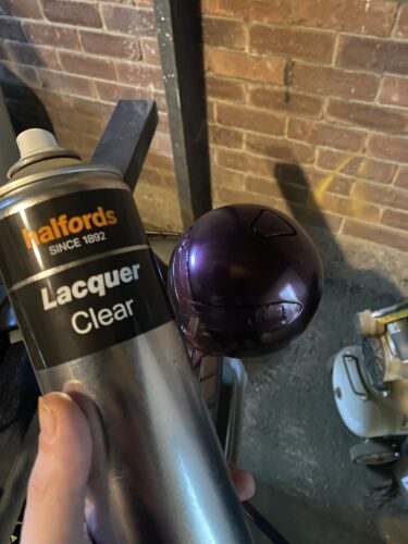 Lacquer spray can in front of the purple Symmetra Turret 3D Print body of the turret.