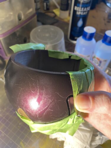 Masking tape being removed from the body of Symmetra Turret 3D print The finish is ruined.