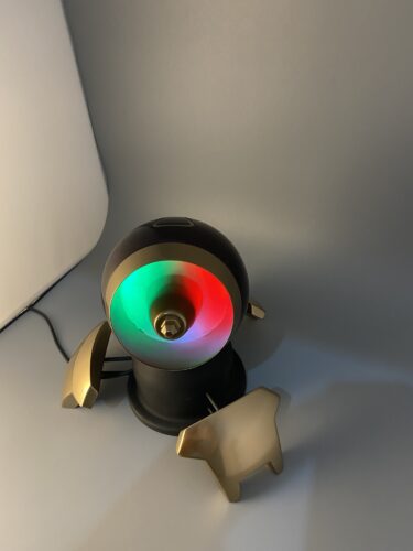 Symmetra's Turret Complete, with a rainbow light shining.