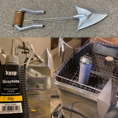 The handle and arrowhead are laid out in finished chrome. Bottle of brushed graphite in the biottom left.