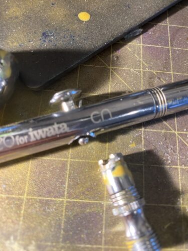 An airbrush (NEO for Iwata) with a sheared intake valve.