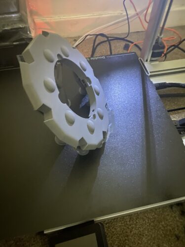 The body of Rikku's Daggers being 3D Printed on grey PLA.