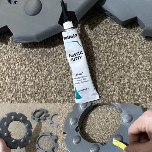 Putty being applie to the underside of the parts.