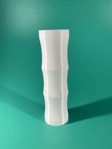 The handle. Part of the Raw Build Kit for the Kokiri Sword from Zelda Majora's Mask, printed in white PLA on a green background.