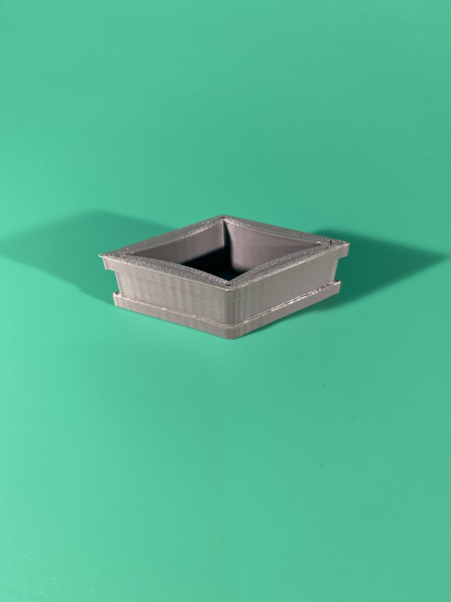 The band. Part of the Raw Build Kit for the Kokiri Sword from Zelda Majora's Mask, printed in greyPLA on a green background.