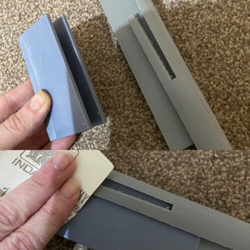 Sanding block designed to reduce the chance of breaking the fins. Image has one next to it and another one in place while being sanded.